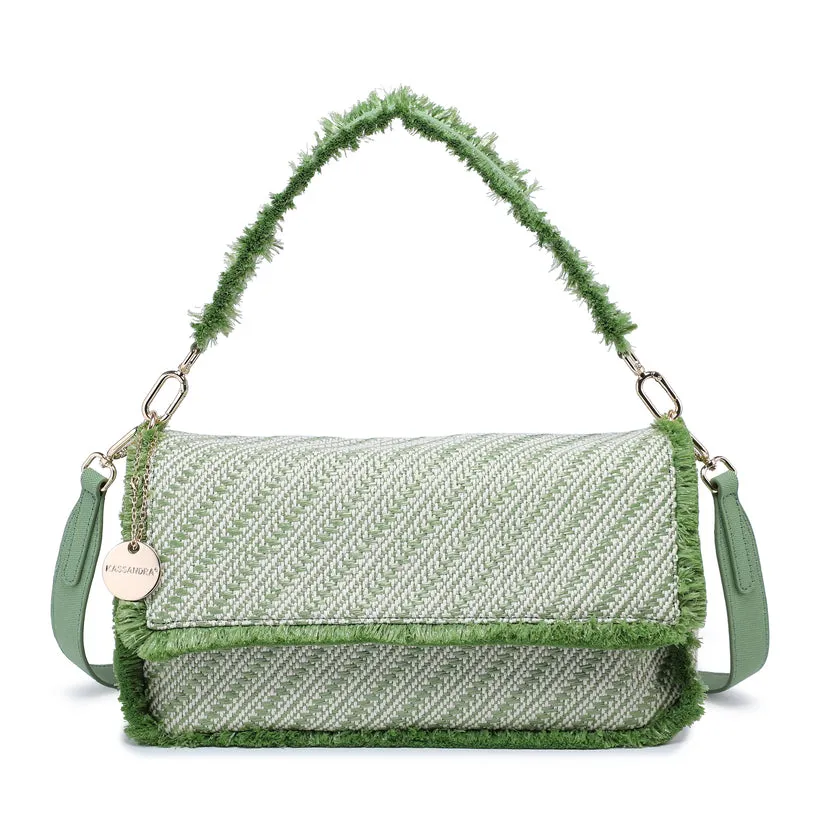 Diagonal woven flap shoulder bag with faux fur trim and charm detail wholesale